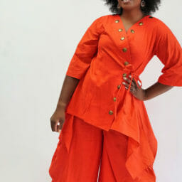 Ashro customer posing in orange Tunic