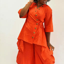 Ashro customer posing in orange Tunic