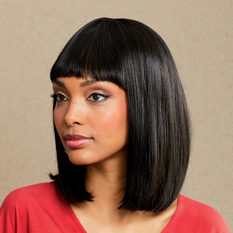 African American woman wearing the Vivica Fox Tria Wig in Off Black