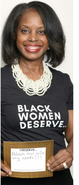 Black Woman wearing Black Women Deserve tee