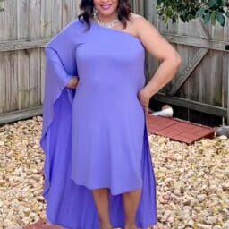 Woman wearing purple one shoulder dress