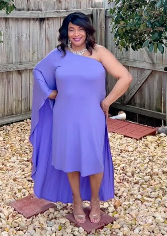 Woman wearing purple one shoulder dress