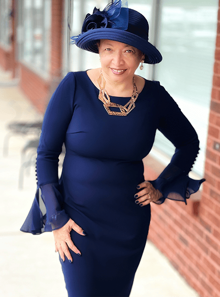 Woman in a blue hat and dress