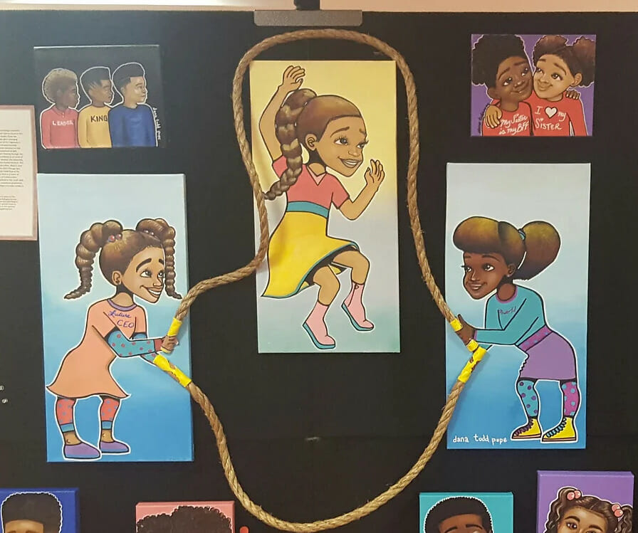Canvas painting of three little black girls playing jump rope. 